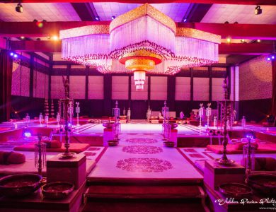 qawwali-night-decor-featuring-flower-chandelier-bolsters-and-embroidered-walls